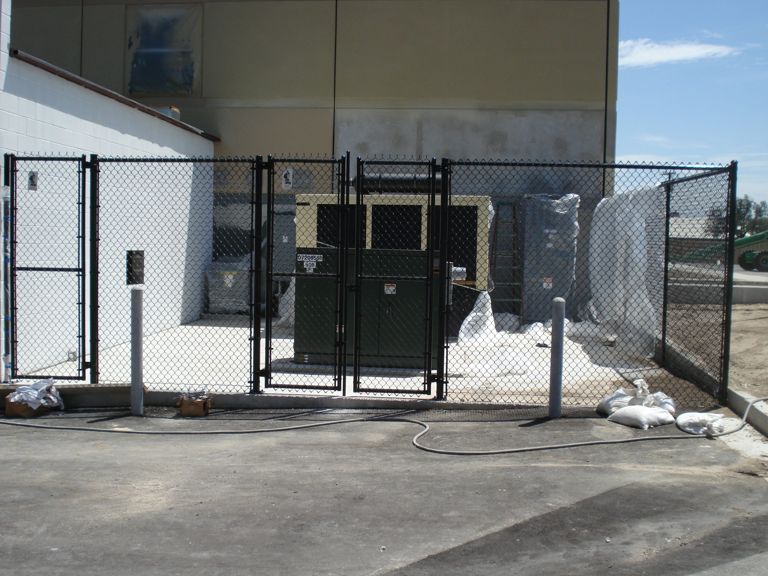 14_Black-Vinyl-Mechanical-Enclosure-scaled-1 After-Hours Retail Protection: Shopping Center Security Gate Access in San Antonio